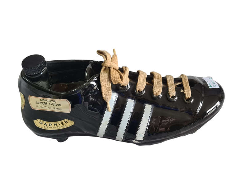 Liquor bottle in the shape of a rugby boot