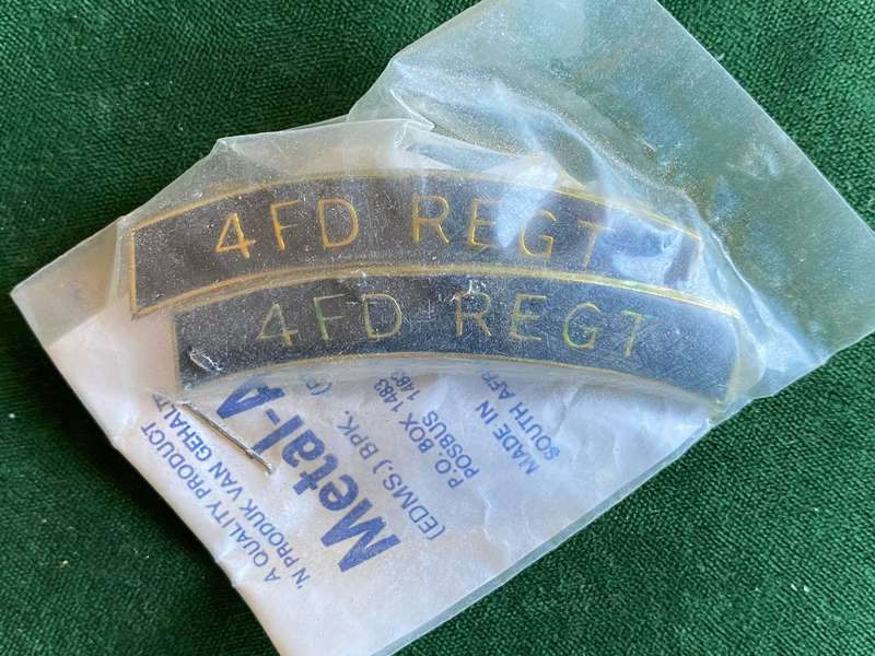 4 FIELD REGIMENT METAL AND ENAMEL SHOULDER TITLE PAIR-STILL SEALED IN PACKAGE,AS FROM METAL ART-ALL