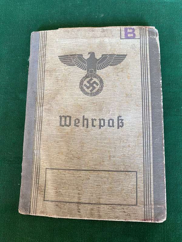 A WEHRPASS-A MILITARY PASSPORT ISSUED TO EVERY SOLDIER IN THE GERMAN WEHR MACHT DURING WW2