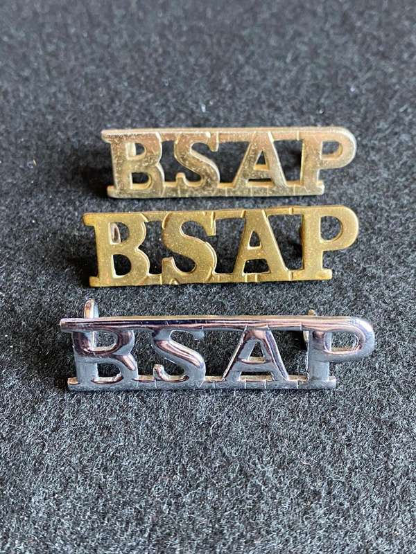 RHODESIA BSA POLICE TITLE BRASS,ANODISED AND CHROME-ONE OF EACH LUGS INTACT