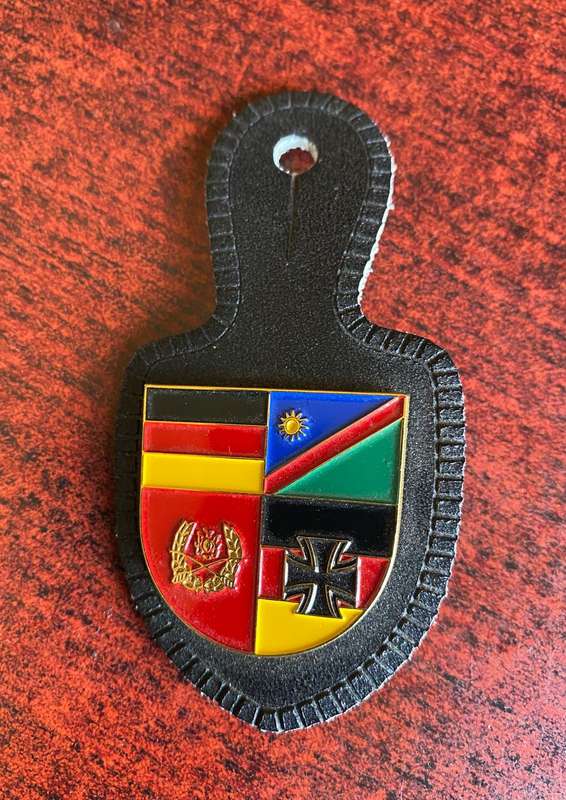 FOB BADGE REPRESENTING A COLLABORATION BETWEEN NAMIBIAN AND GERMAN SERVICES