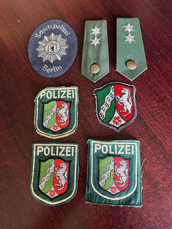 SELECTION OF WEST GERMAN POLICE PATCHES AND RANKS
