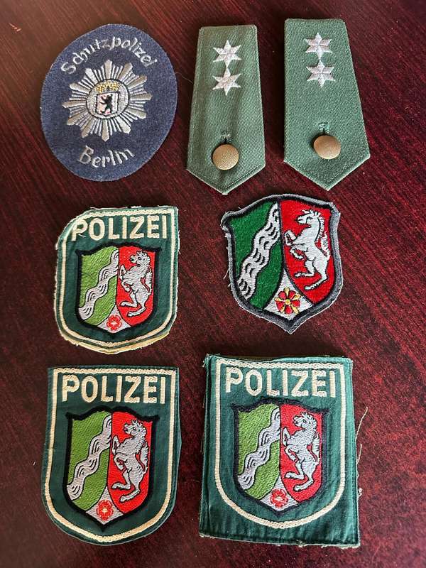 SELECTION OF WEST GERMAN POLICE PATCHES AND RANKS