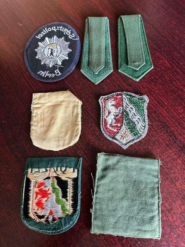 SELECTION OF WEST GERMAN POLICE PATCHES AND RANKS