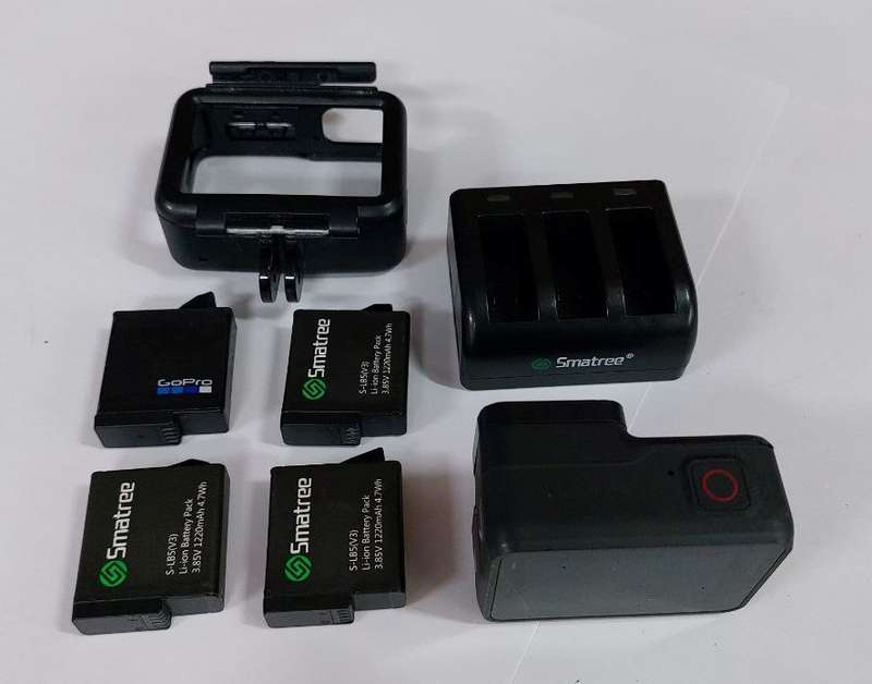 GoPro 7 Black Camera  with 4 Batteries, Charger and Frame Holder