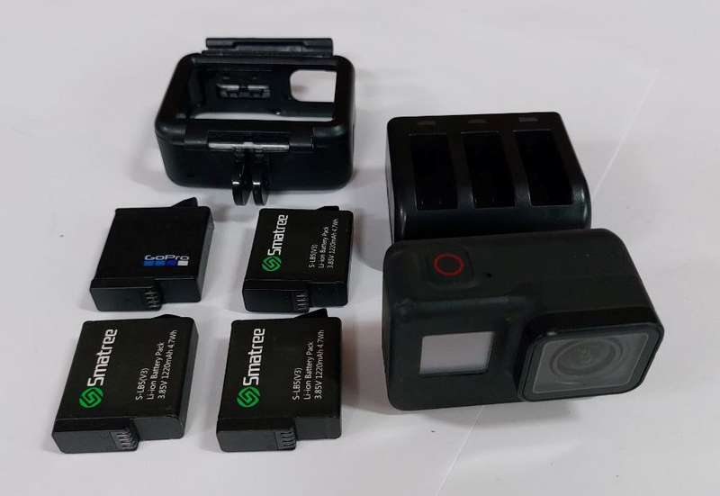 GoPro 7 Black Camera  with 4 Batteries, Charger and Frame Holder