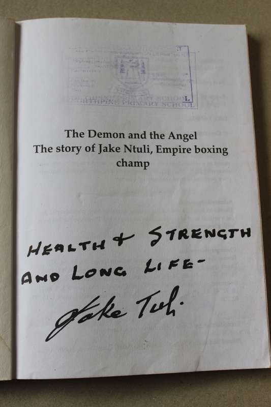 THE DEMON AND THE ANGEL  Story of Jake Ntuli, Empire Boxing Champion  (SINGED)