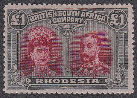 RHODESIA 1910 DOUBLE HEADS £1 CRIMSON AND SLATE BLACK WITH BUTTON FLAW VAR FINE MINT SG 166a