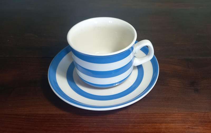 CORNISHWARE - KITCHEN WARE TEA CUP AND SAUCER