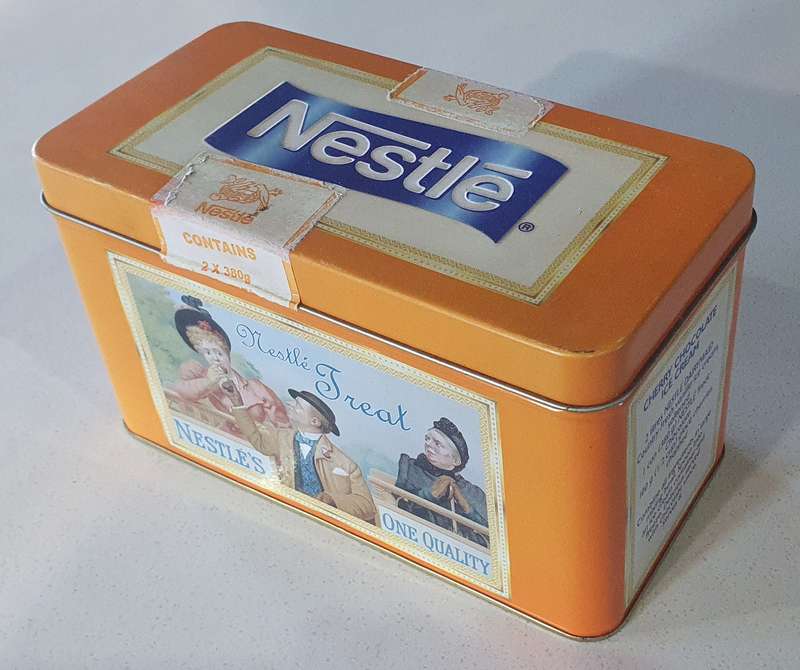 NESTLE tin as per photos