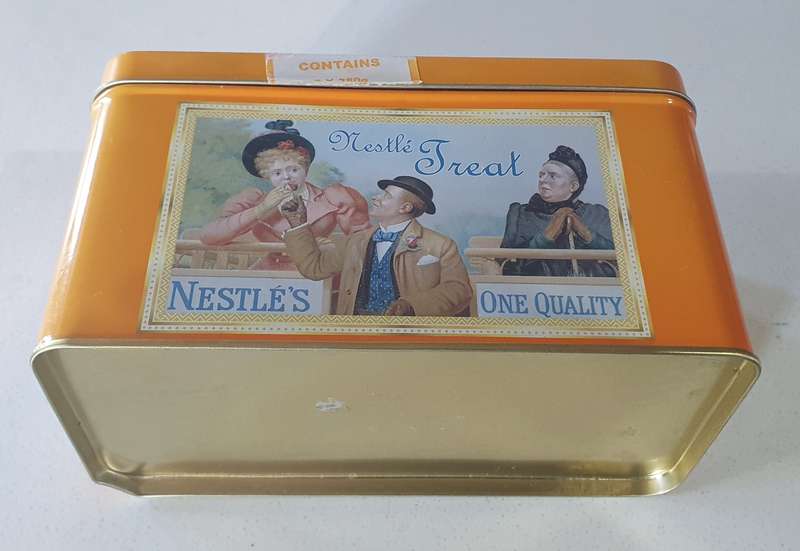 NESTLE tin as per photos