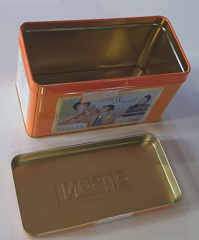 NESTLE tin as per photos