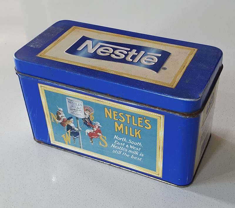 NESTLE tin as per photos