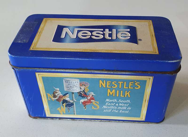 NESTLE tin as per photos