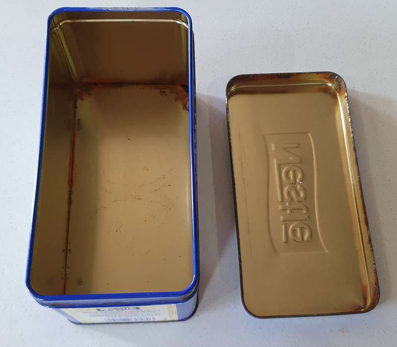 NESTLE tin as per photos