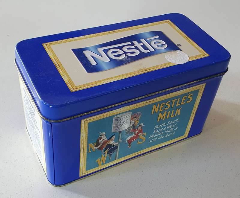 NESTLE tin as per photos