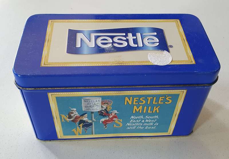 NESTLE tin as per photos
