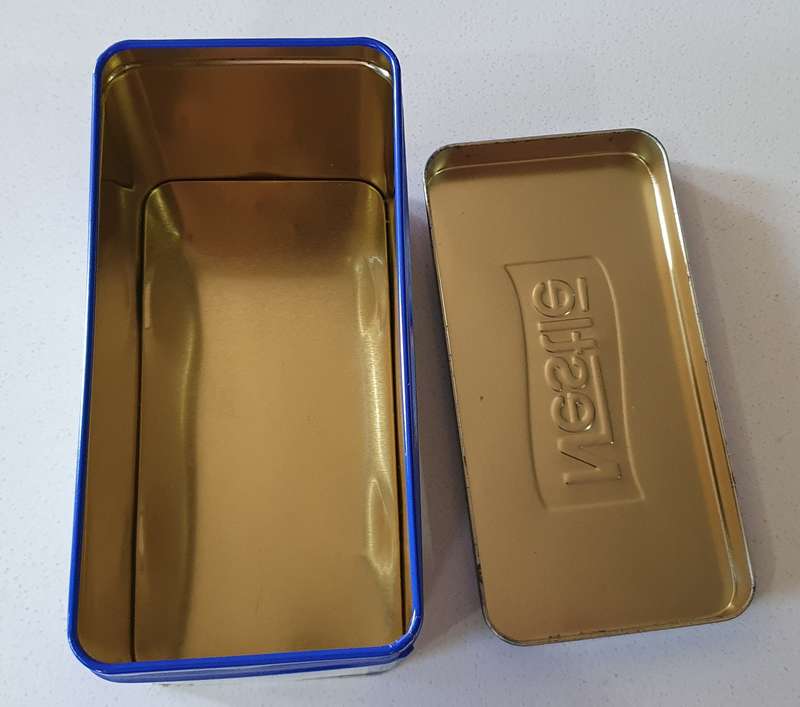 NESTLE tin as per photos