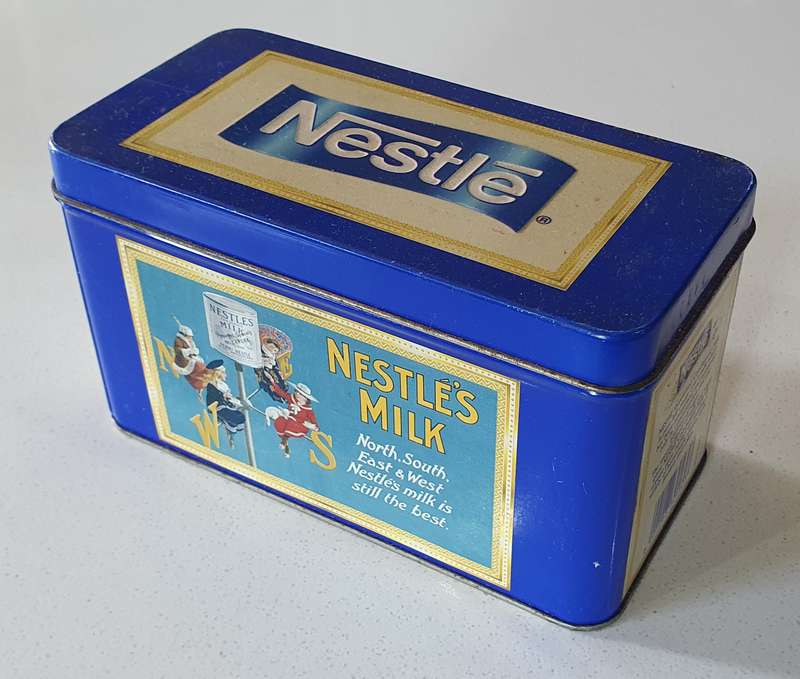 NESTLE tin as per photos