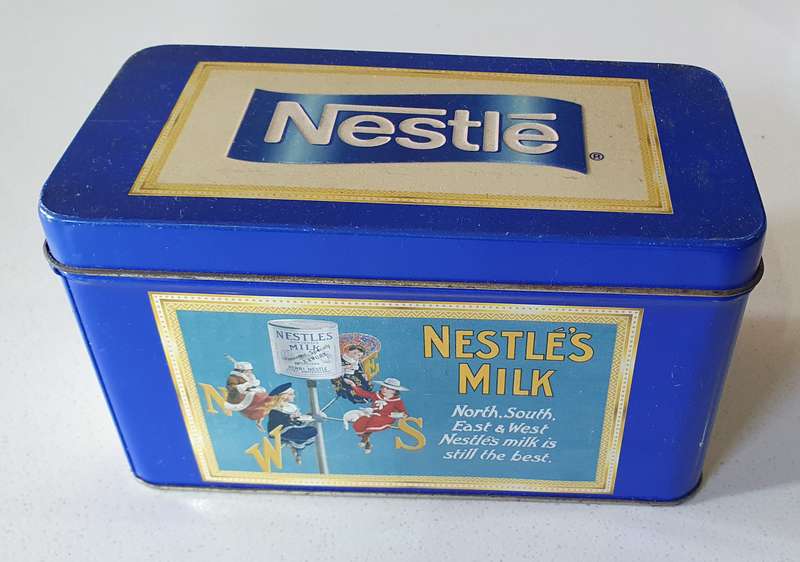 NESTLE tin as per photos