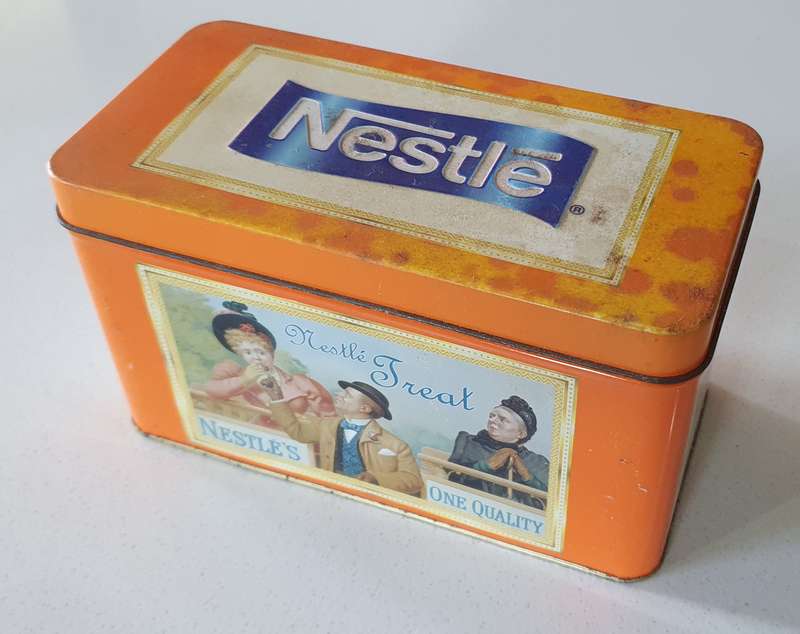 NESTLE tin as per photos