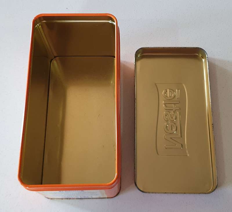 NESTLE tin as per photos