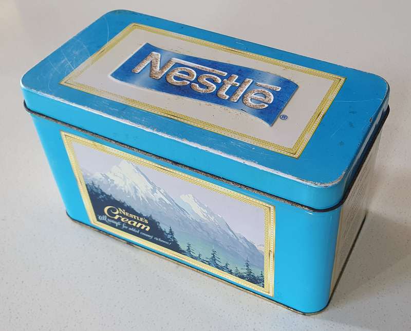 NESTLE tin as per photos