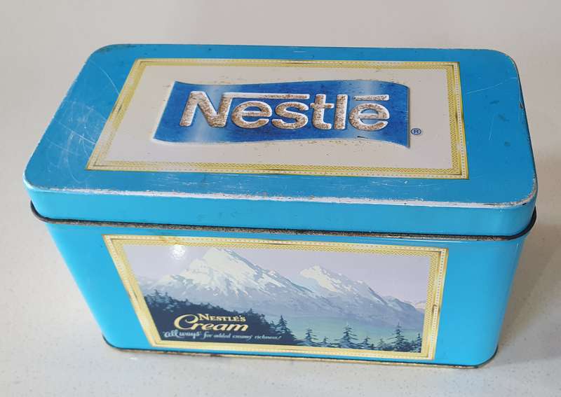 NESTLE tin as per photos