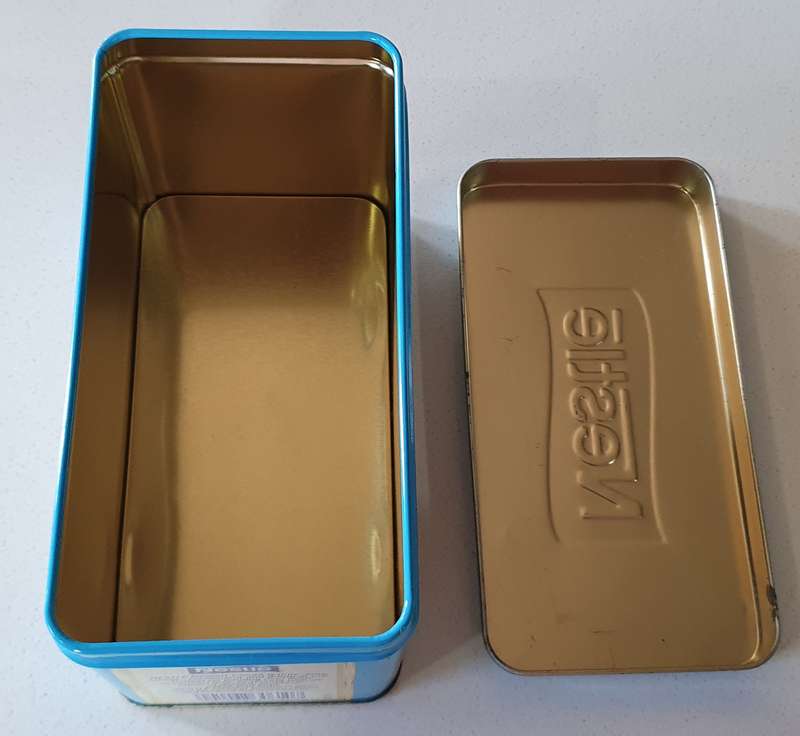 NESTLE tin as per photos