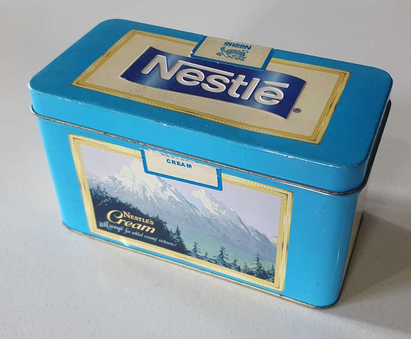 NESTLE tin as per photos