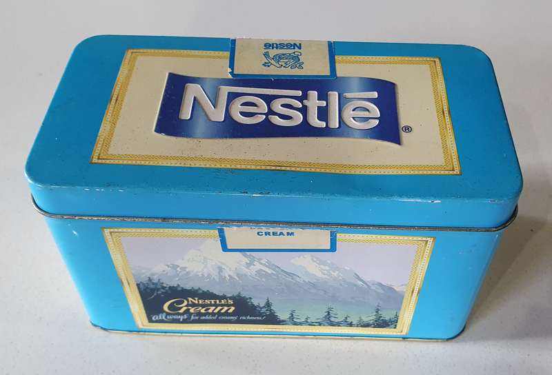 NESTLE tin as per photos