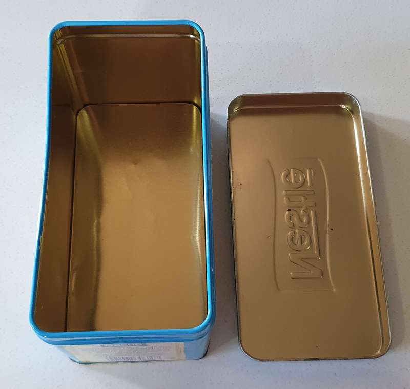 NESTLE tin as per photos