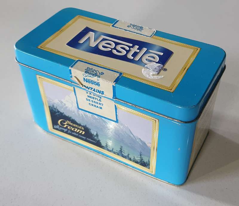 NESTLE tin as per photos