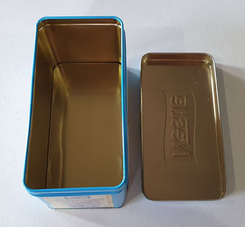 NESTLE tin as per photos