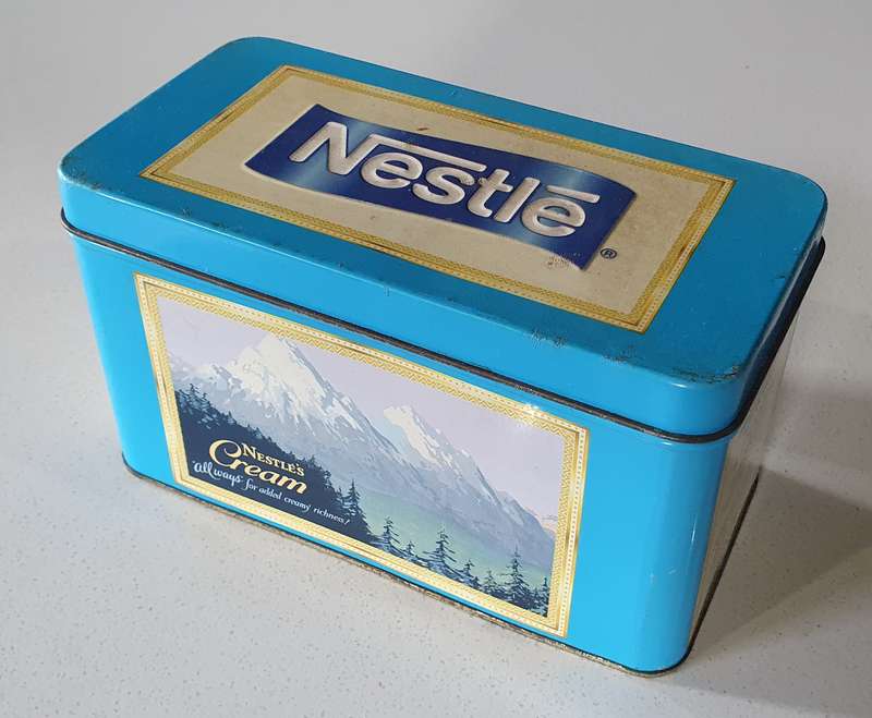 NESTLE tin as per photos