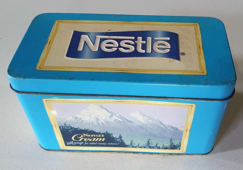 NESTLE tin as per photos