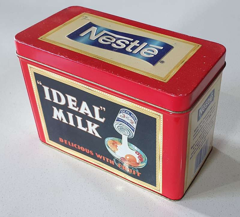 NESTLE tin as per photos