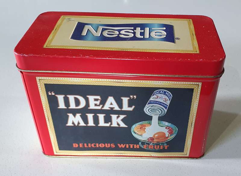 NESTLE tin as per photos