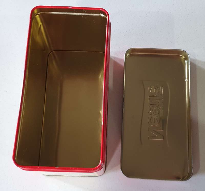 NESTLE tin as per photos