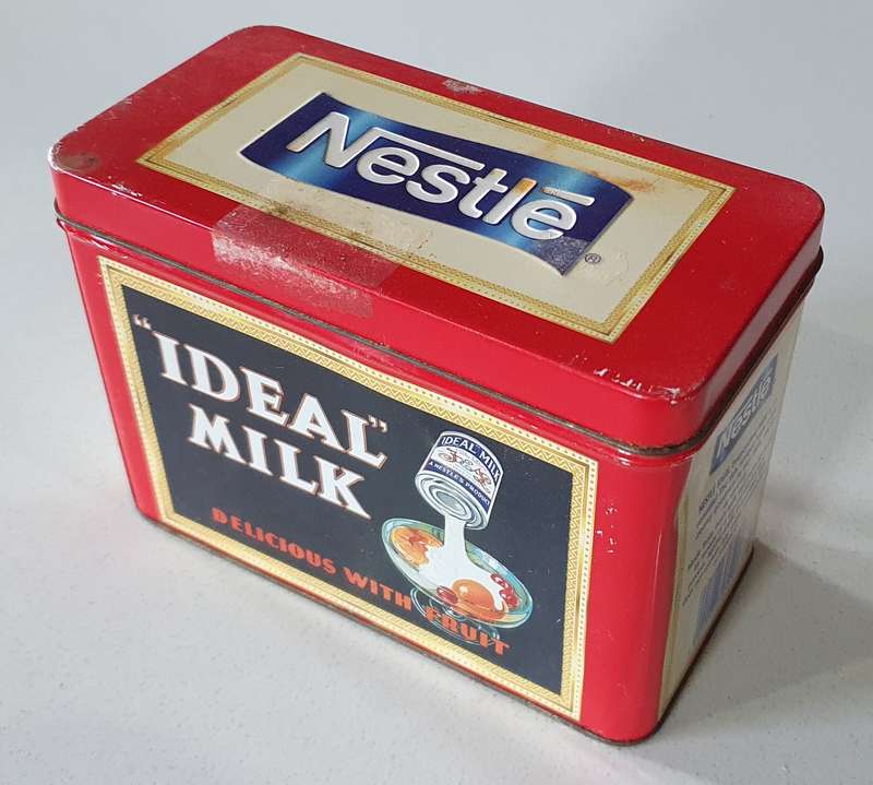 NESTLE tin as per photos