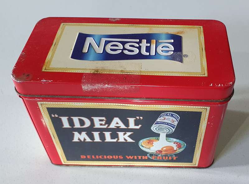 NESTLE tin as per photos
