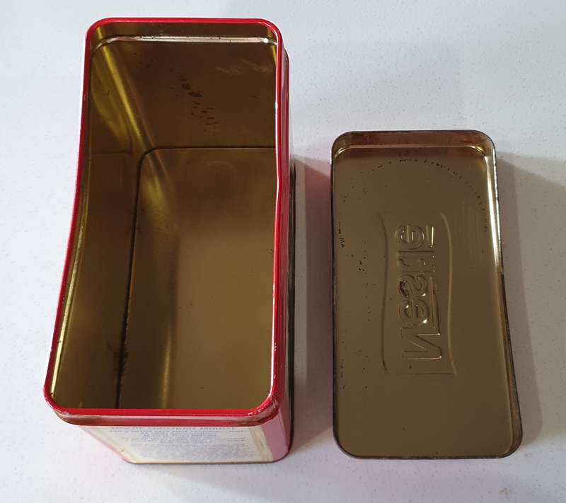 NESTLE tin as per photos