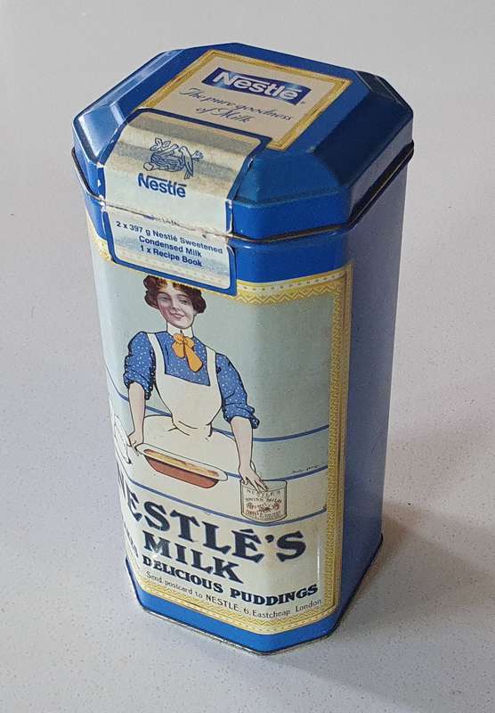 NESTLE tin as per photos