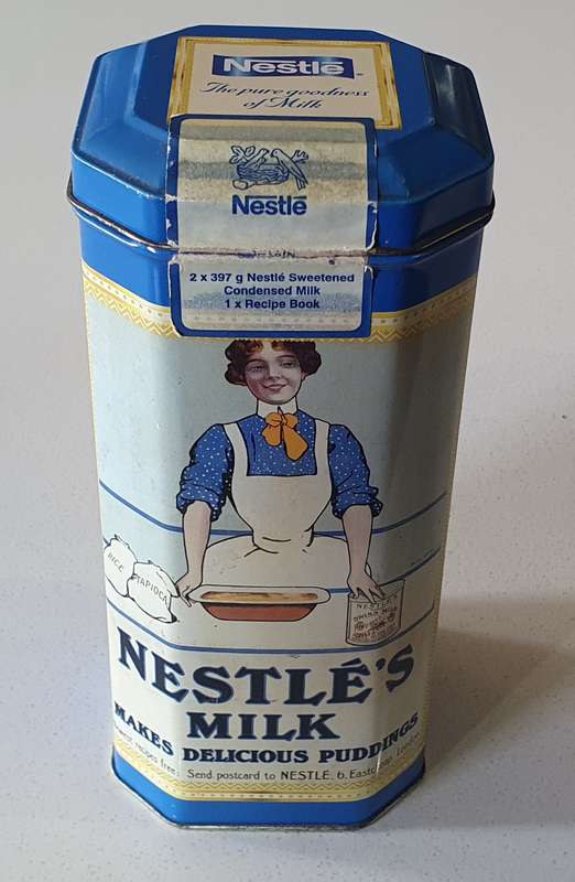 NESTLE tin as per photos