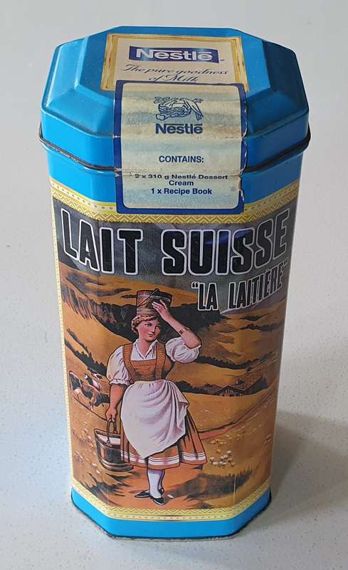 NESTLE tin as per photos