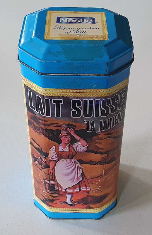 NESTLE tin as per photos