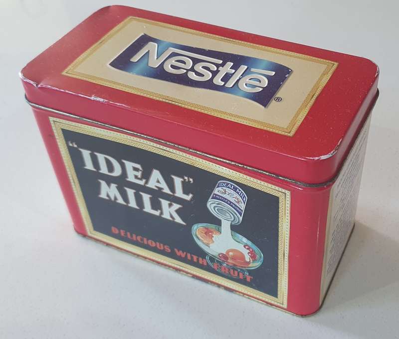 NESTLE tin as per photo