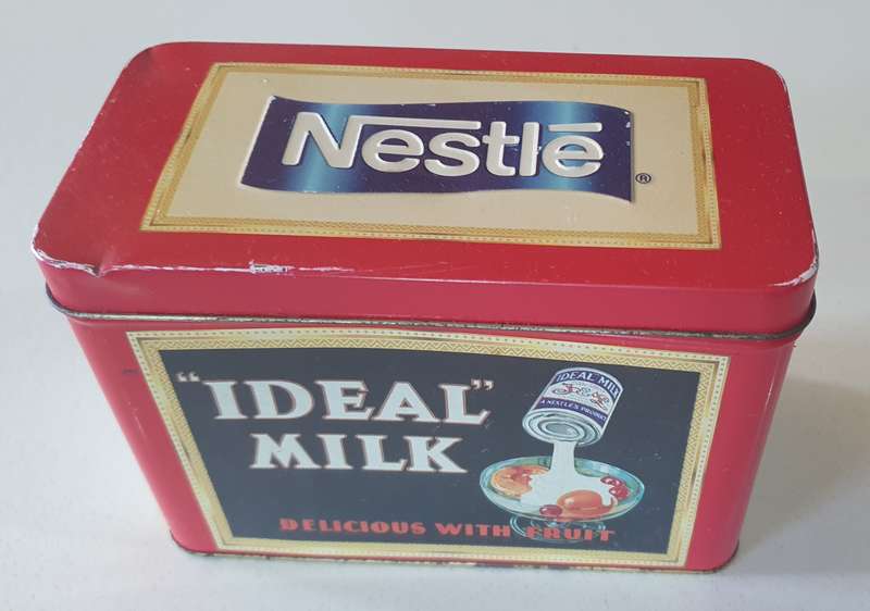 NESTLE tin as per photo