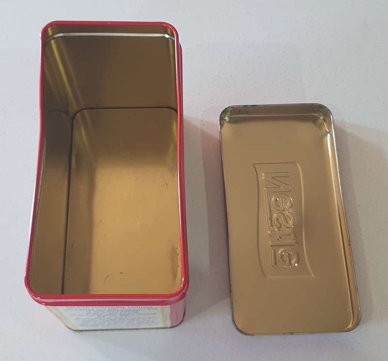 NESTLE tin as per photo