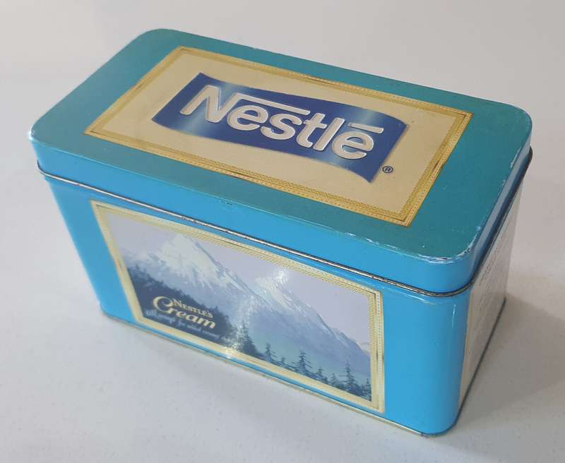 NESTLE tin as per photo